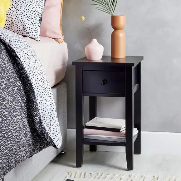 black nightstand in a bedroom. Make Your Bedroom Look Expensive