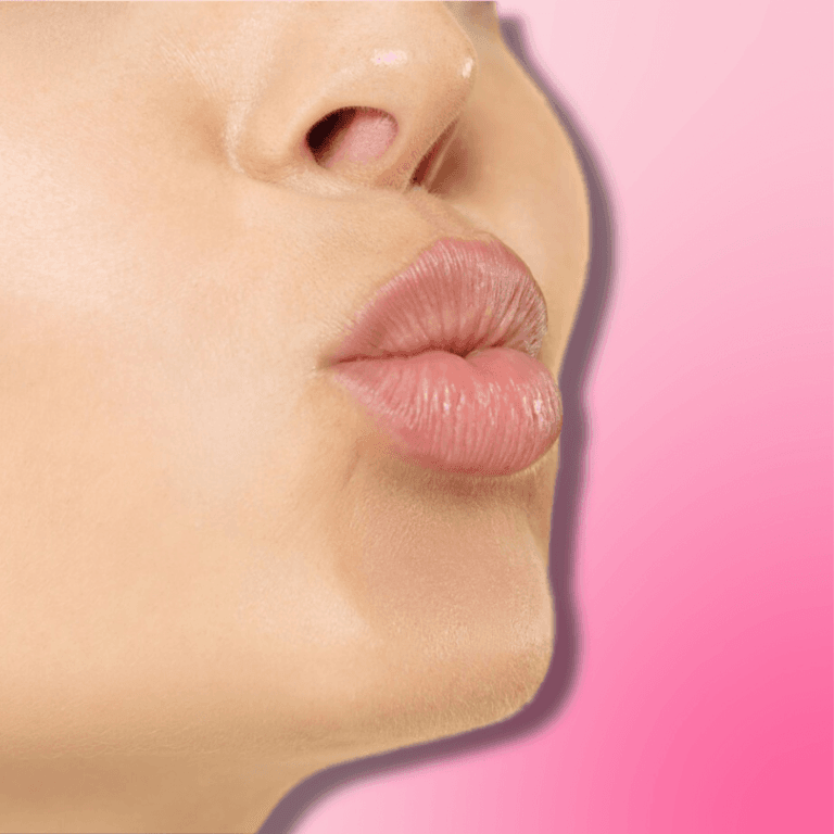 Close up of a woman pouting with pink lips