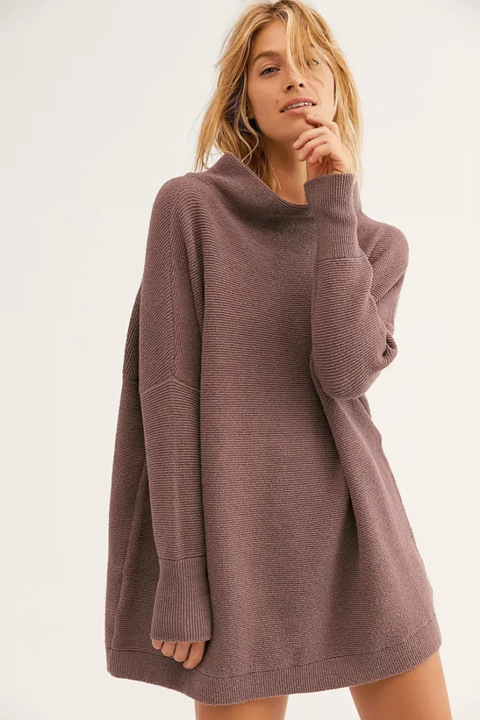 Model wears brown jumper dress. best knitted dresses