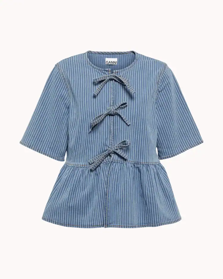 denim striped bow trimmed peplum blouse from Ganni. Bows on clothes