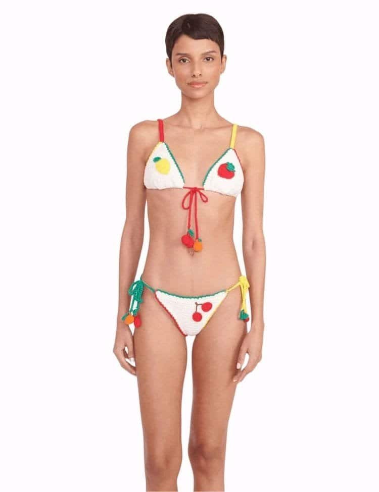 Model wears crochet fruit bikini set. crochet fashion trend
