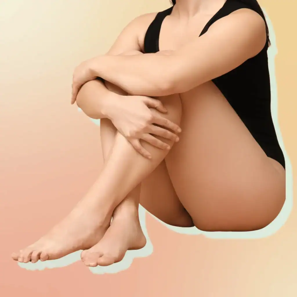 Body-Positive-Young-Woman-Sitting-on-orange-gradient-Background