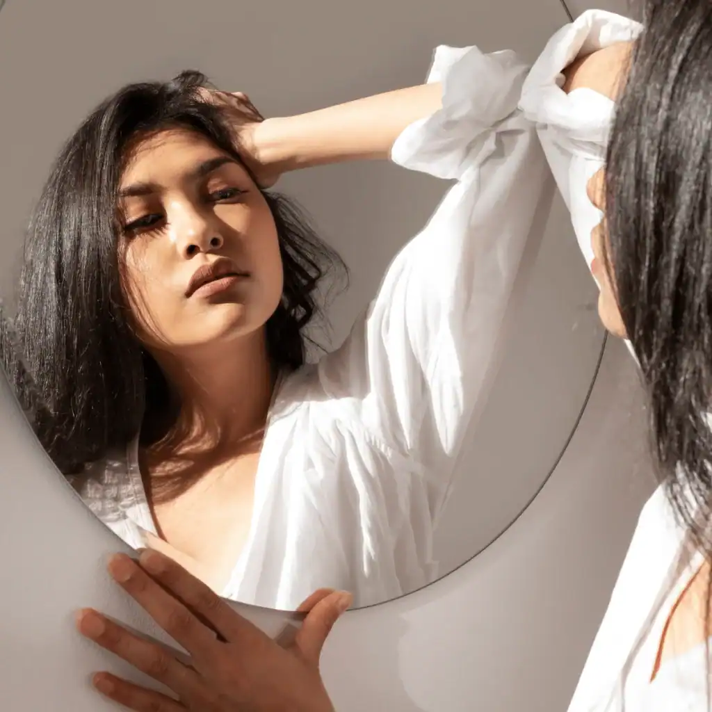 Reflection-of-a-young-beautiful-woman-in-a-mirror