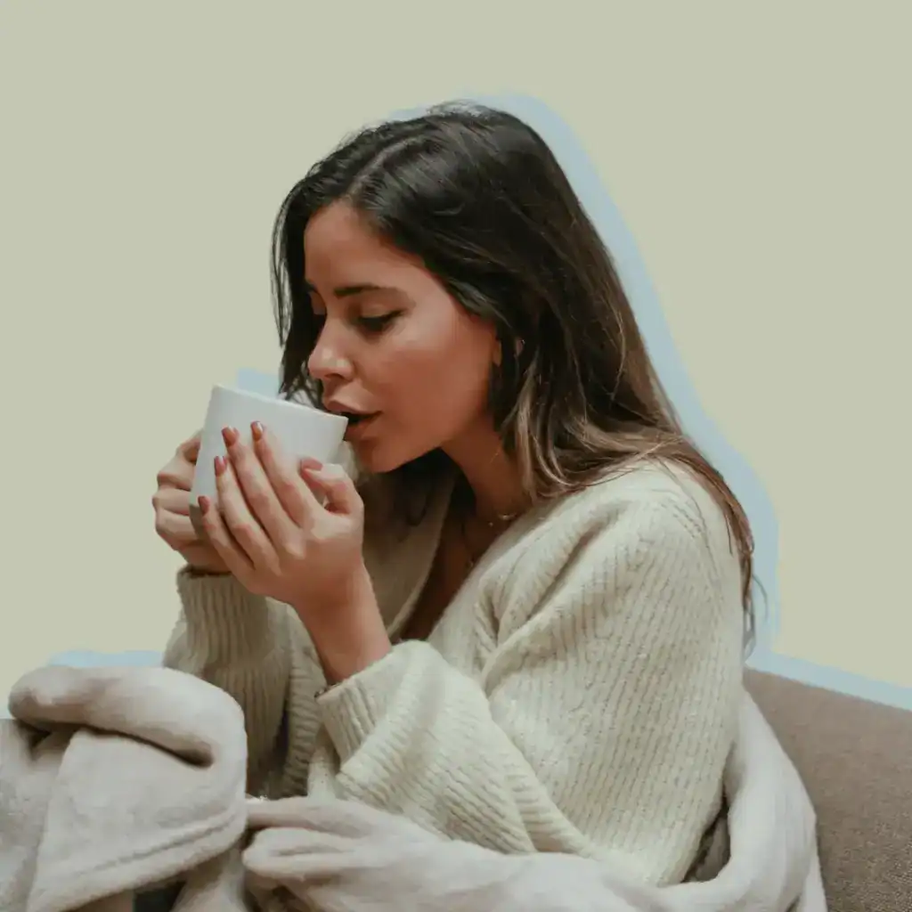 Self-Care-Morning-Rituals.-Woman-in-a-cosy-cardigan-drinking-from-a-cup