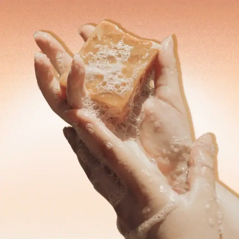 Soap-bar-in-a-womans-hands.-3-Homemade-Turmeric-Soap-Recipes