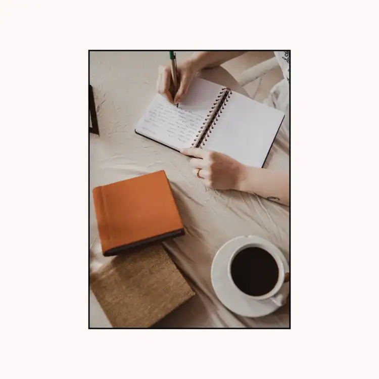 Woman-Writing-on-Notebook.-Saturday-selfcare-ideas