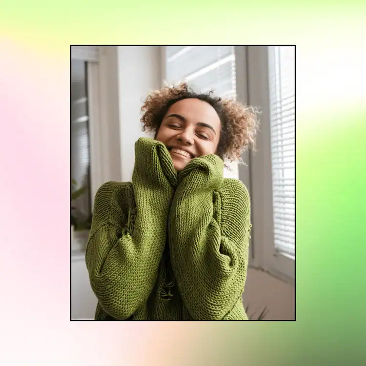 Woman-wearing-a-green-jumper-hugging-herself.-Powerful-Gratitude-Affirmations-for-Wealth-and-Abundance