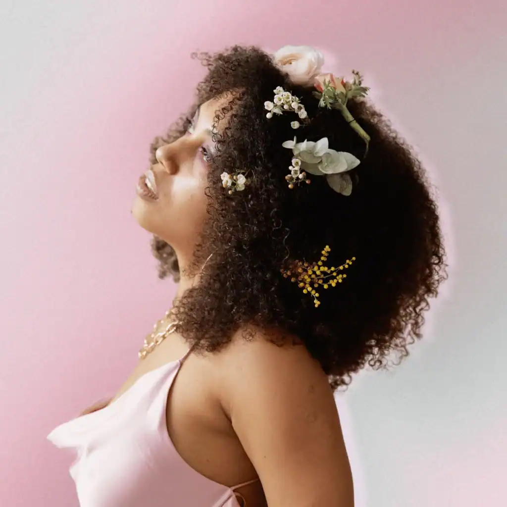 Woman with flowers in her afro