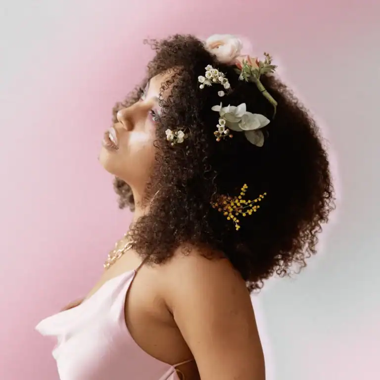 Woman with flowers in her afro