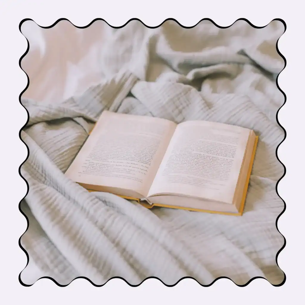 open-book-on-a-crinkled-bed-throw. Morning Journal Prompts