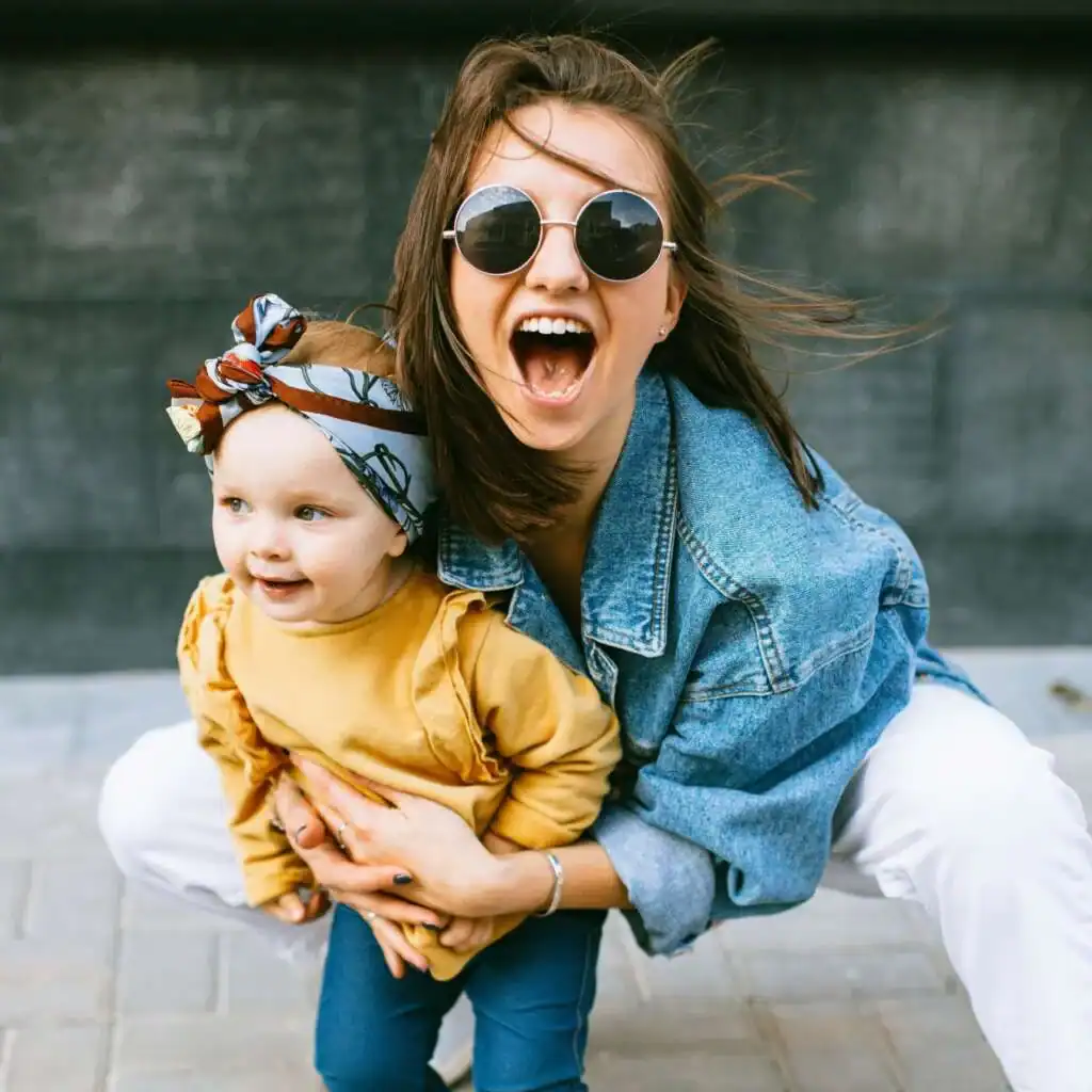 woman-holding-a-female-toddler-and-smiling.-Babysitting-concept-1024x1024-1