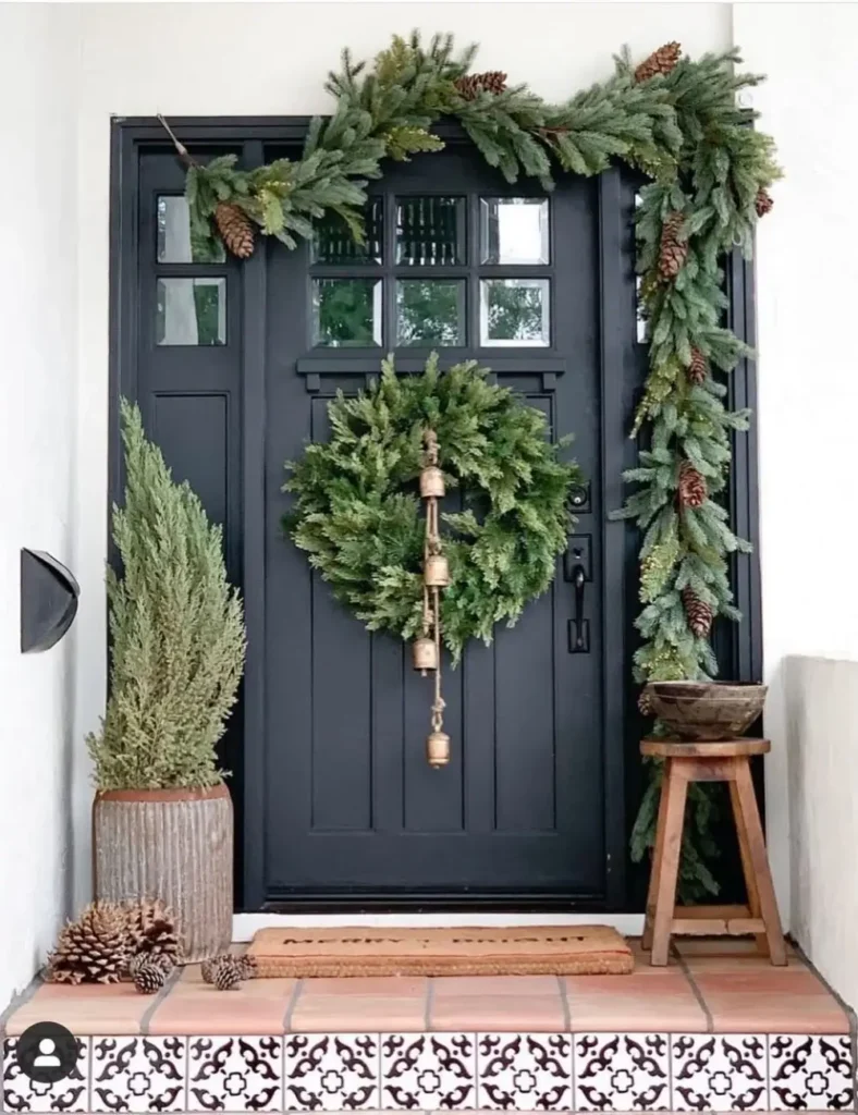 Christmas Front Porch Ideas with pine cones and leaf garland